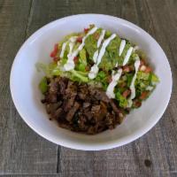 Carne Asada Burrito Bowl · Grilled marinated angus steak, rice, Jack cheese, salsa and lettuce choice of pinto or black...