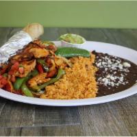 Chicken Fajitas · Marinated chicken breast, fresh bell peppers, onion and pico de gallo, served with a side of...