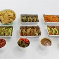 Taco Family Platter · Serves six. Includes fifteen tacos. Served with rice, choice of beans, guacamole, pico de ga...