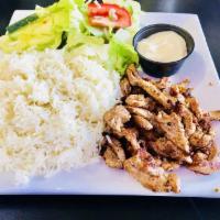 Beef Shawarma Platter · Beef or chicken, rice, house salad, tahini and garlic sauce. Served with pita bread.