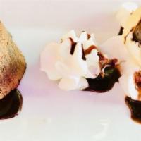Lava Cake with Ice Cream · Warm chocolate cake, chocolate filling with vanilla ice cream.