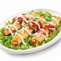 Chicken Taquitos · Chicken taquitos are served on a bed of shredded lettuce and garnished with pico de gallo, s...