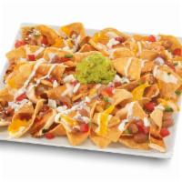 Chicken Super Nachos · Charbroiled chicken with freshly prepared tortilla chips, pinto beans, four-cheese blend and...