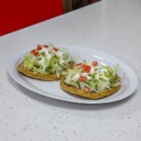 Sopes · They carry beans, lettuce, cheese, sour cream, tomato. They carry beans, lettuce, cheese, so...
