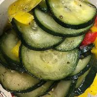 14 oz. Cucumber Salad · Sliced cucumber tossed with chopped bell peppers and onion, dressed in a simple blend of ext...