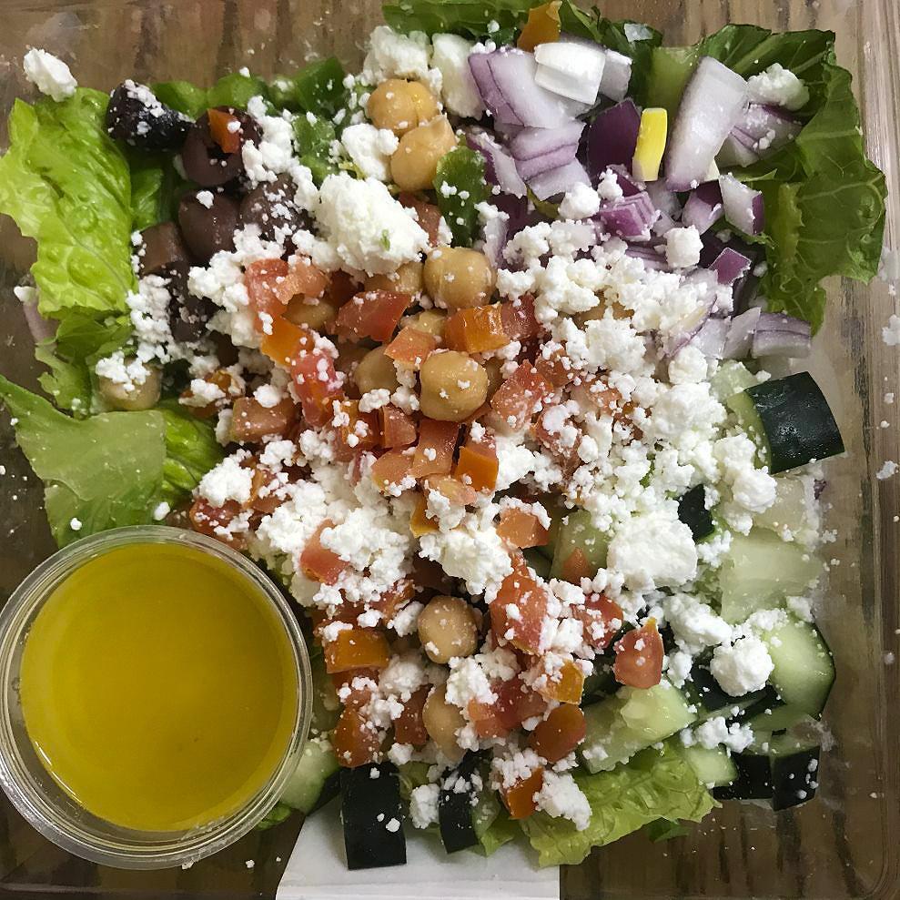 14 oz. Mediterranean Chopped · Chopped romaine lettuce topped with crumbled feta cheese, red onion, chick peas, tomato, cucumber, bell pepper and Kalamata olives. Paired with a side of Italian dressing. [Allergens: Milk]