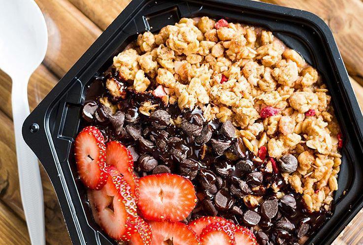 VACATIONER BOWL · Bananas, Strawberries, and Chocolate Chips. Topped with Strawberry Granola Mix, and Chocolate Chips