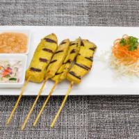 4 Pieces Satay · Grilled tender strips of marinated chicken on skewers, served with a side of peanut sauce an...