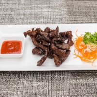 Crispy Sunshine Beef · Marinated thin slices of oven-dried beef, fried to perfection and served with Thai spicy red...