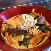 Red Curry Noodles in Coconut Curry Dinner · String beans, eggplant, bamboo shoots, bell peppers and basil leaves in coconut red curry ov...