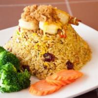 Pineapple Fried Rice · Stir-fried jasmine rice with egg, pineapple, tomatoes, onions, scallions, dried cranberries,...