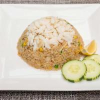 Crabmeat Fried Rice · Stir-fried jasmine rice, egg, crabmeat, celery, carrots and green peas in our flavorful chef...
