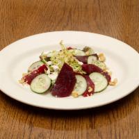 Beet Salad (V) · baby beets, walnut, fancy greens, cucumber, house vinaigrette