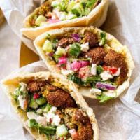 Falafull Wrap · Middle eastern spiced ground chickpeas formed into balls, hummus, lettuce, pickles, and tahi...
