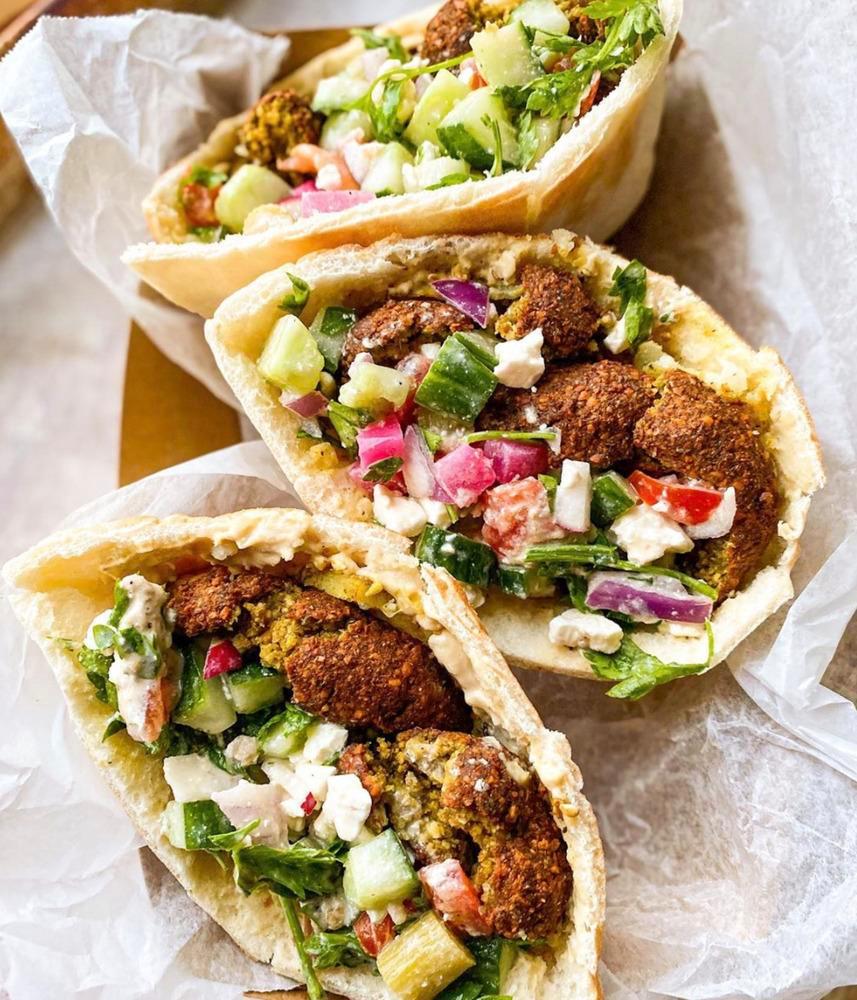 Falafull Wrap · Middle eastern spiced ground chickpeas formed into balls, hummus, lettuce, pickles, and tahini salad wrapped in thin homemade pita bread, served with tahini sauce.