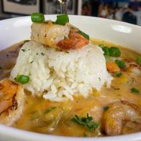 Shrimp Etoufee  · A spicy Cajun stew made with shrimp served over rice.