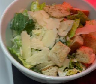 Classic Caesar Salad · Shaved Parmesan, Caesar dressing, torn croutons.