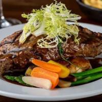 Grilled NY Steak · Served with wild mushrooms, red wine demi, garlic mashed potatoes, garden vegetables