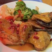 Free Range Chicken · with pomegranate sauce, seasonal vegetables, roasted fingerling potatoes