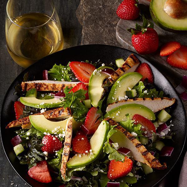 Strawberry Avocado Salad · Grilled Chicken, Avocado, Strawberries, Super Greens, Red Onions, Cucumber, Cotija Cheese, Balsamic Dressing