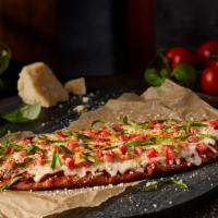 Margherita Pizza · Marinara Sauce, Fresh Mozzarella, Diced Roma Tomatoes, Sweet Basil