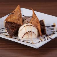 Brownie Sundae · Warm Puff Pastry Filled with Chocolate Hazelnut. Topped with Powdered Sugar