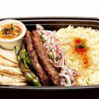 Beef Lula Kabab · 1 skewer of grilled ground beef with parsley, onions, rice, grilled vegetables and pita bread