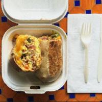 Double Meat Breakfast Burrito · A warm flour tortilla filled with scrambled eggs, jack cheese, cheddar cheese, avocado, cris...
