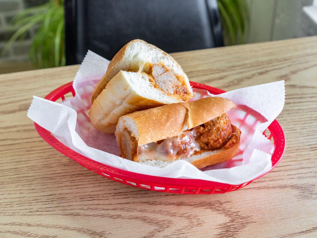 15. Meatball Parmesan Sandwich · Served with cheese and marinara sauce.