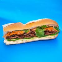 Grill BBQ Pork Sandwich · Barbecue Pork topped with pickled carrots & daikon radish, cucumber, cilantro, jalapeño, Fre...