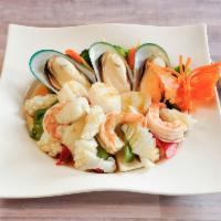 Ocean Seafood · A combination of shrimps, scallops, squid, mussels, onion, green beans and bell peppers saut...