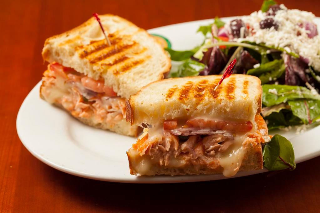 Salmon & Brie Panini · Roasted fresh salmon, melted Brie, tomatoes, fresh dill, capers and onions.
