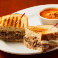 Steak Panini · Flat iron steak with grilled mushrooms, bell peppers and onions. Topped with melted Smoked M...