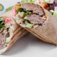 Koobideh Wrap · Charbroiled ground all natural ABF beef kabob, Roma tomatoes, cucumbers, tzatziki and pickle...