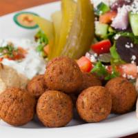 Falafel Platter · Falafel (vegan) made from garbanzo beans and herbs. Served with hummus, tzatziki, pickles an...