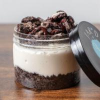 Oreo Cheesecake Jar  · Creamy Vanilla Cheesecake on chocolate oreo crust, with layers of oreo crumbles and fudge.
