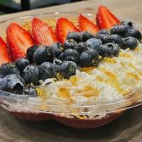 Pacific Beach Acai Bowls · Blended acai topped with strawberry, blueberry, granola, coconut shavings and honey.