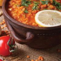 Lentil Soup · A hearty vegetable soup made fresh lentils, finely diced onion, tomato, celery, cilantro, ca...