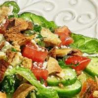 Fatoush Salad · Chopped lettuce, tomato, feta cheese, Persian cucumbers, mint and pita croutons. Vegetarian.