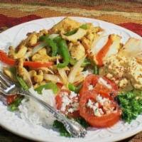 Chicken Shawarma · Tender julienned strips of chicken. Served with tahini sauce, chopped tomato.