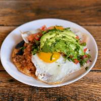 Huevos Rancheros · two fried eggs, pico de gallo, tostadas, black bean puree, salsa roja, avocado, cilantro