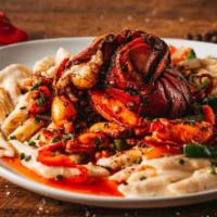 Jerk Lobster Rasta Pasta · Jerk Lobster tail ＆ meat, Penne Pasta, Peppers ＆ Onions, Jerk Alfredo Sauce.