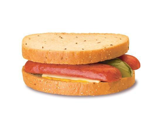 Polish Sandwich · Spicy Polish sausage is split and placed between 2 slices of warm rye bread, then topped with Swiss cheese, pickle spear, and french's tangy mustard.