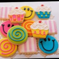 Small Assorted Cookie Platter · 12 assorted decorated sugar cookies place on a clear platter, wrapped in cellophane and tied...