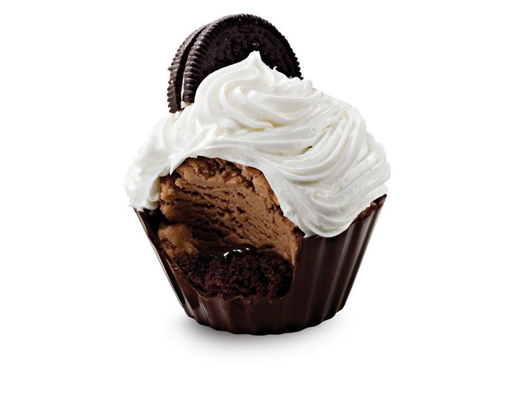 Double Chocolate Devotion Cupcake · a rich chocolate chip filled with a layer of devil's food cake, fudge and chocolate ice cream topped with fluffy white frosting and an oreo cookie