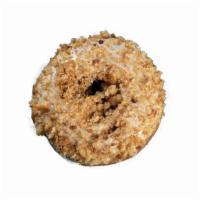 Apple Crumb Donut · Apple cake donut dipped in cream cheese glaze and topped with apple and cinnamon sugar crumb...