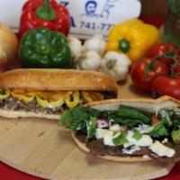 Oven Baked Gyro Sub · Lamb gyro meat, feta cheese, onions, lettuce, tomatoes and our house sauce. On toasted pita 