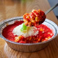 Hot Cheetos Elote · Creamy Mexican street corn topped with spicy hot Cheetos, cotija cheese & lime.