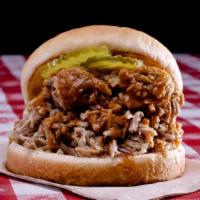BBQ Pork Sandwich · Add garlic toast and slaw for an additional charge. Thick cut of meat from a pig typically c...