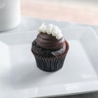 Chocolate Cream Cupcake · Chocolate cake filled with our signature buttercream topped with fudge frosting with a dollo...